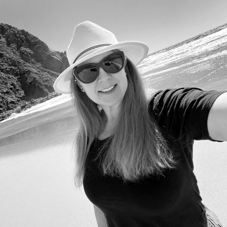 Black-and-white portrait of Gretchen Miller at the beach